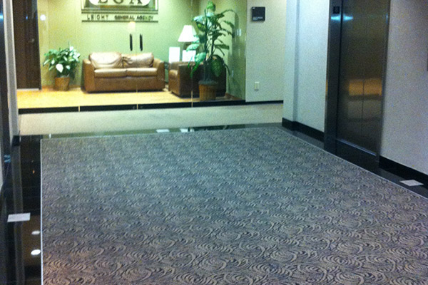 Carpet and tile floor installation in a Houston building.
