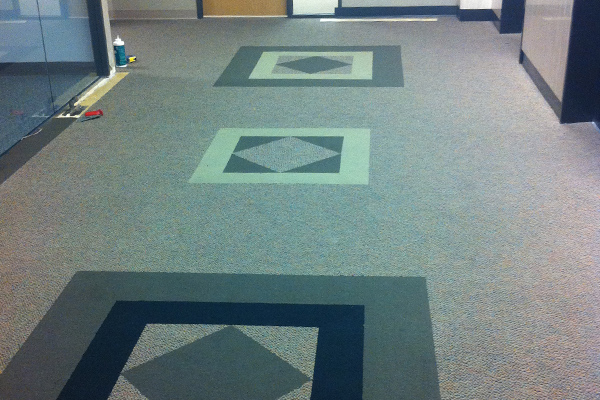 Carpet with inlay installation in Houston.