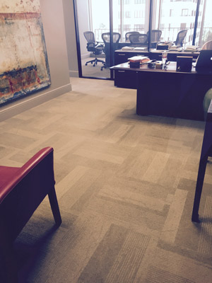 Carpet tile floor installation in a Houston office building.